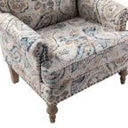 Fauteuil rembourré en bois avec motif floral, accoudoirs à panneaux et dossier en forme de bosse de chameau.
