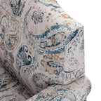 Fauteuil rembourré en bois avec motif floral, accoudoirs à panneaux et dossier en forme de bosse de chameau.
