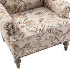 Fauteuil rembourré en bois avec motif floral, accoudoirs à panneaux et dossier en forme de bosse de chameau.
